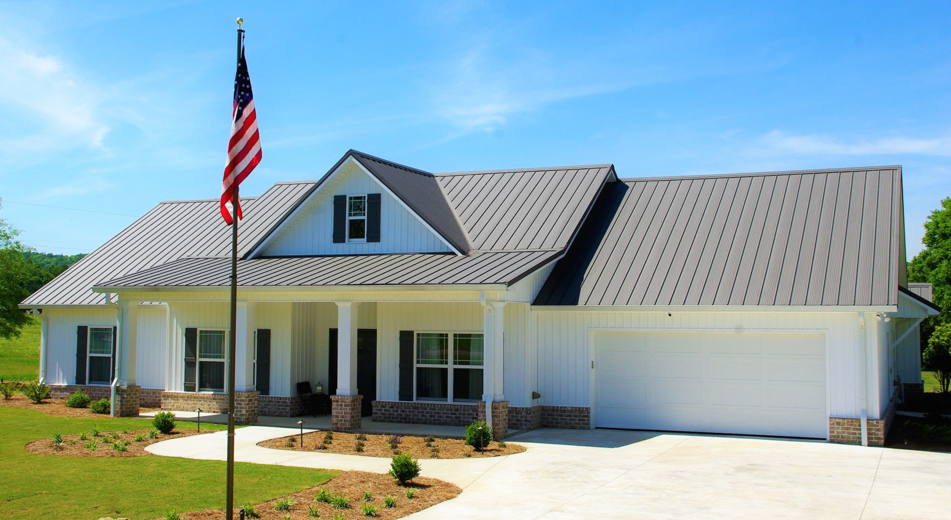 Front of House With Flag Pole - Metal Roofing Products